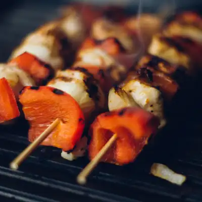 A grill with some kabobs on it