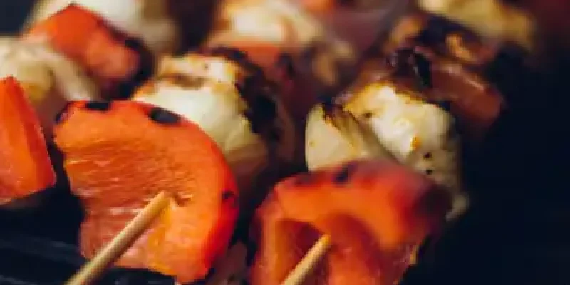 A grill with some kabobs on it